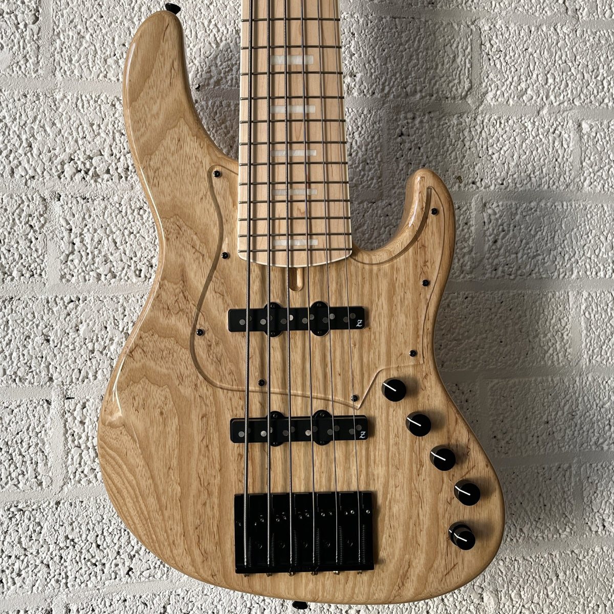 Atelier Z Beta6 6-string bass in Natural finish with black hardware body closeup