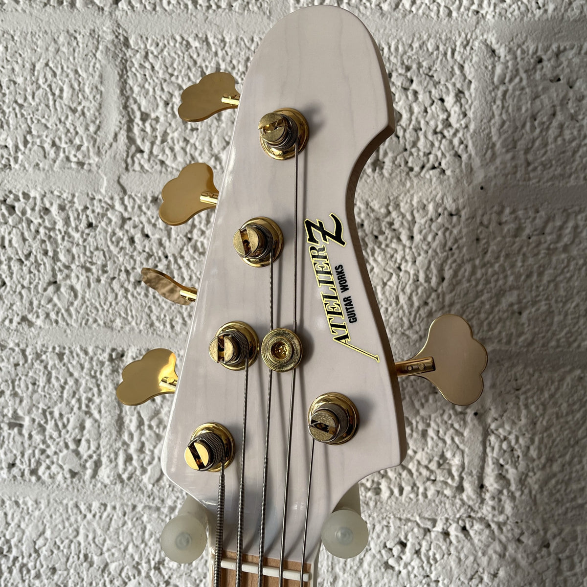 Atelier Z JHJ-265 Custom 5-string bass in Transparent White with gold hardware headstock