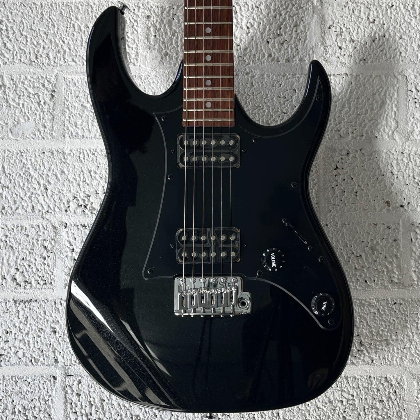 ibanez grx20 black night electric guitar body closeup