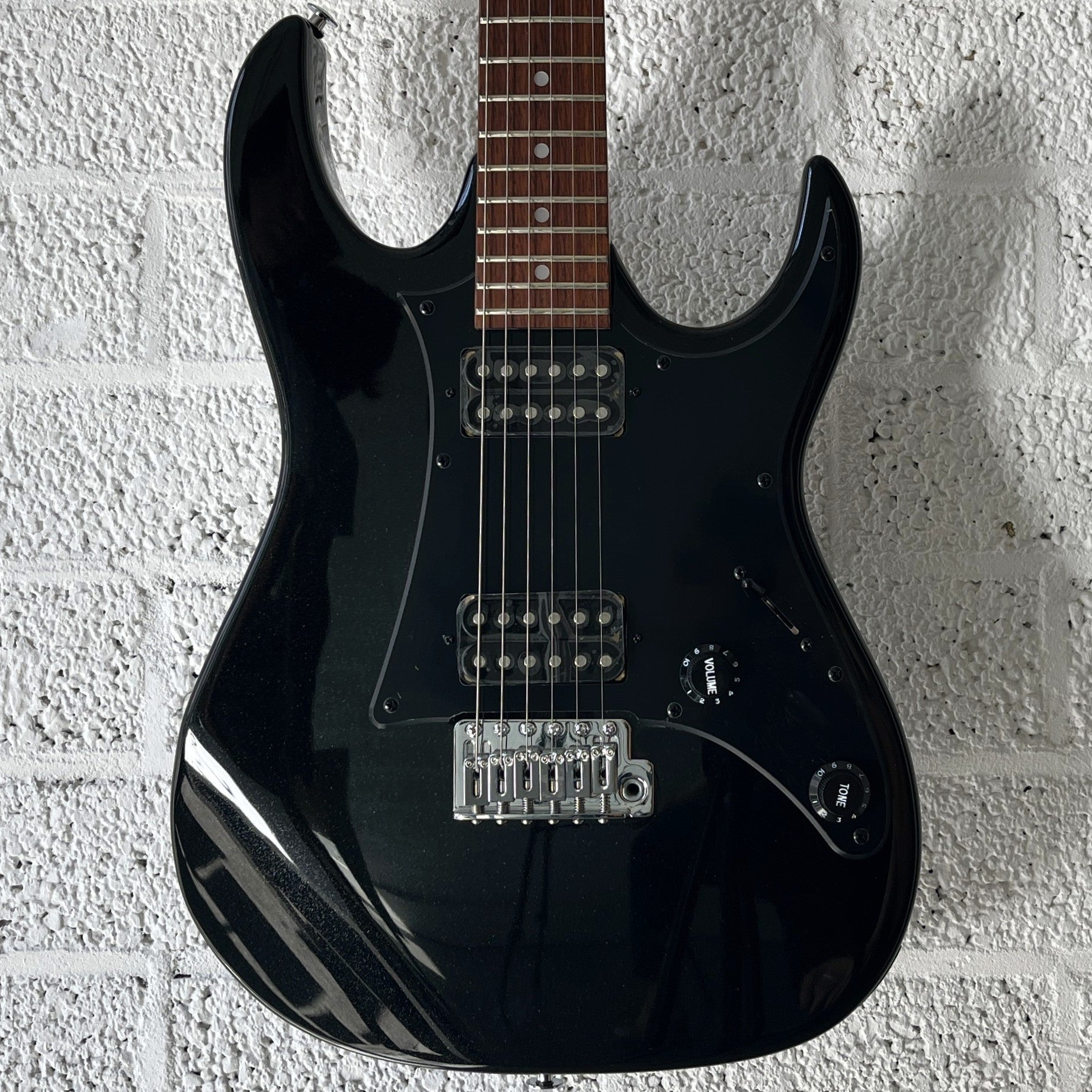 ibanez grx20 black night electric guitar body closeup