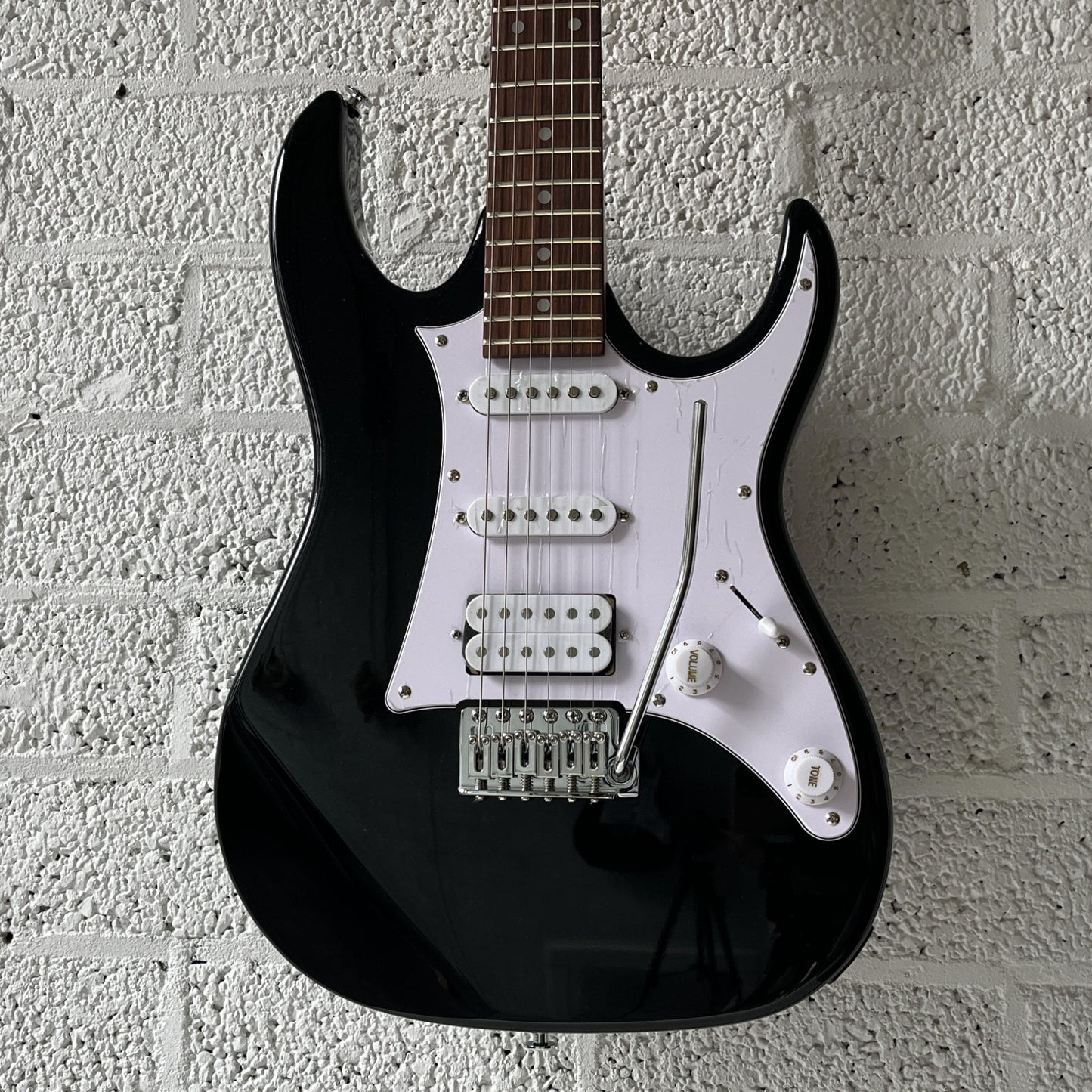 ibanez grx40 black night electric guitar body closeup
