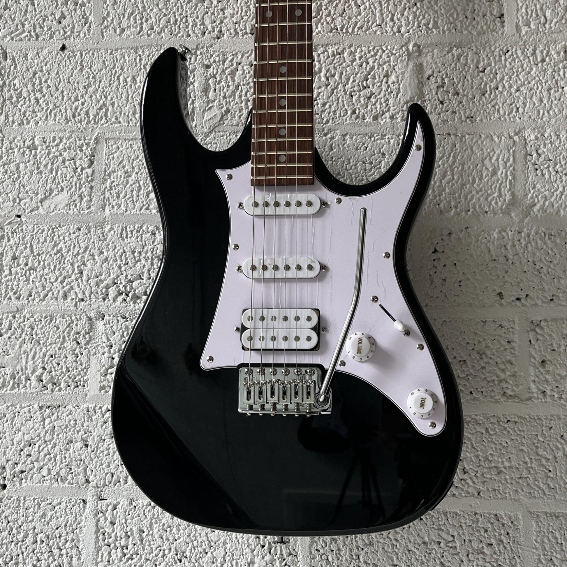 ibanez grx40 black night electric guitar body closeup
