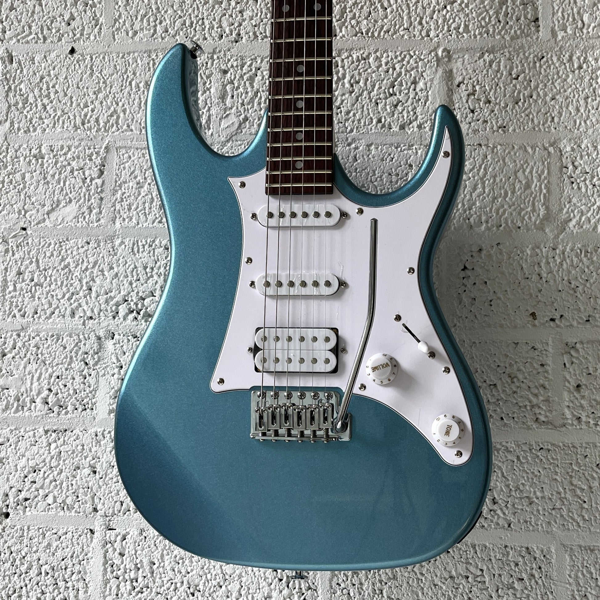 ibanez grx40 metallic light blue electric guitar body closeup