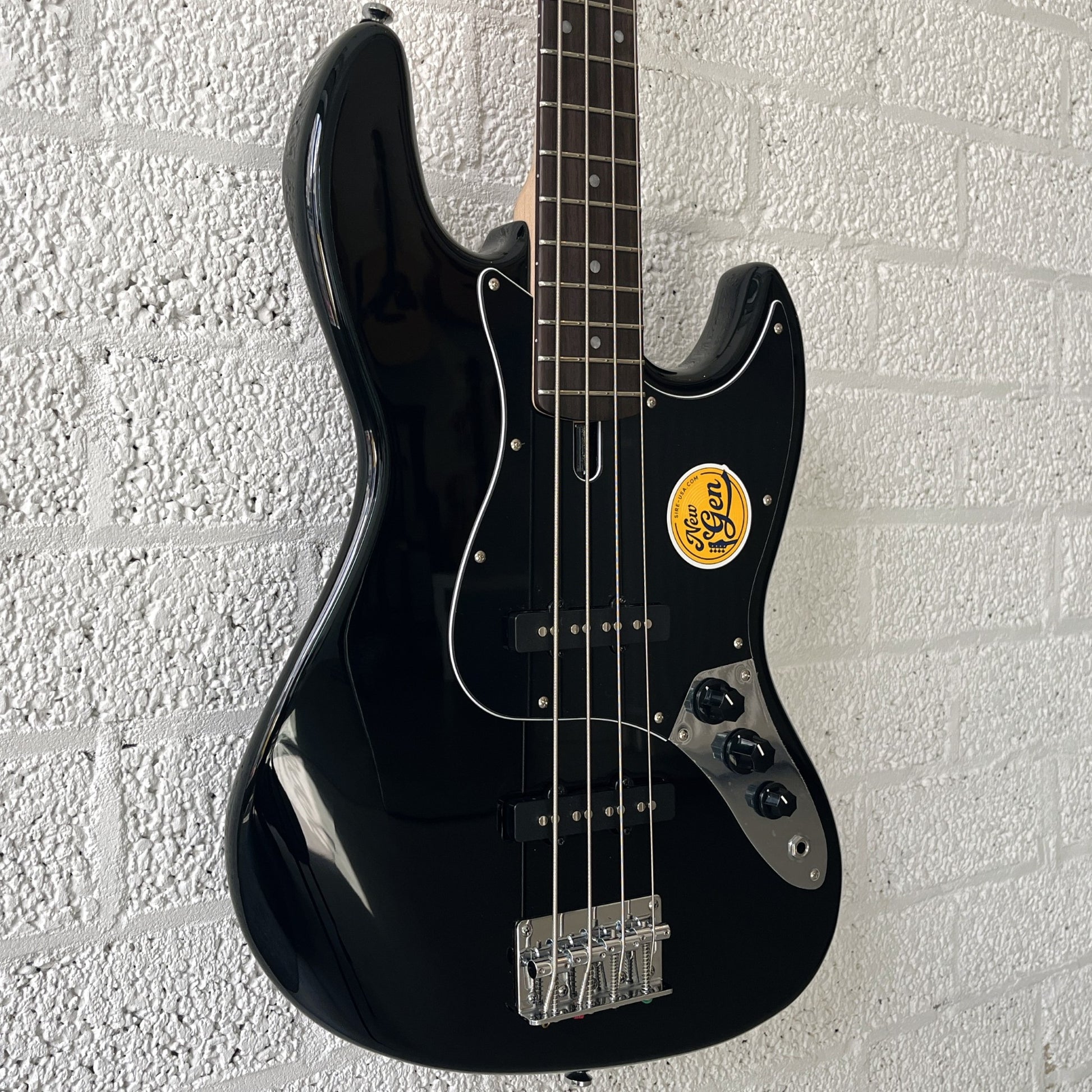 sire marcus miller v1 electric bass black angled right
