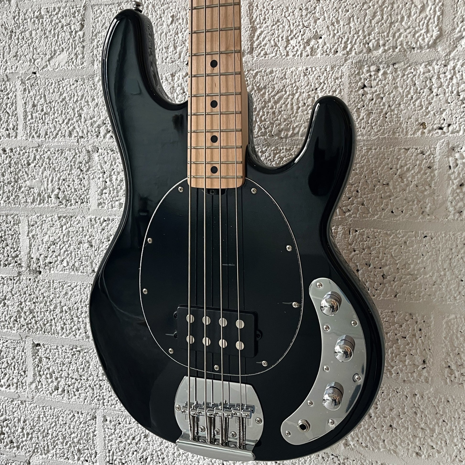 sterling by music man sub series stingray ray4 black body closeup angled right