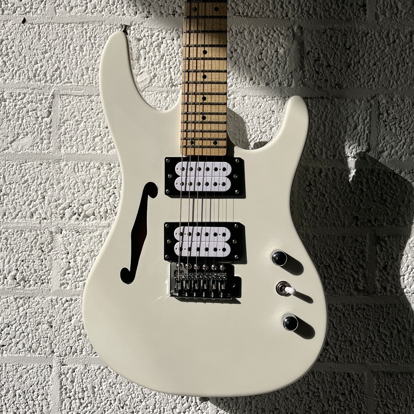 sx sst mini white electric guitar body closeup