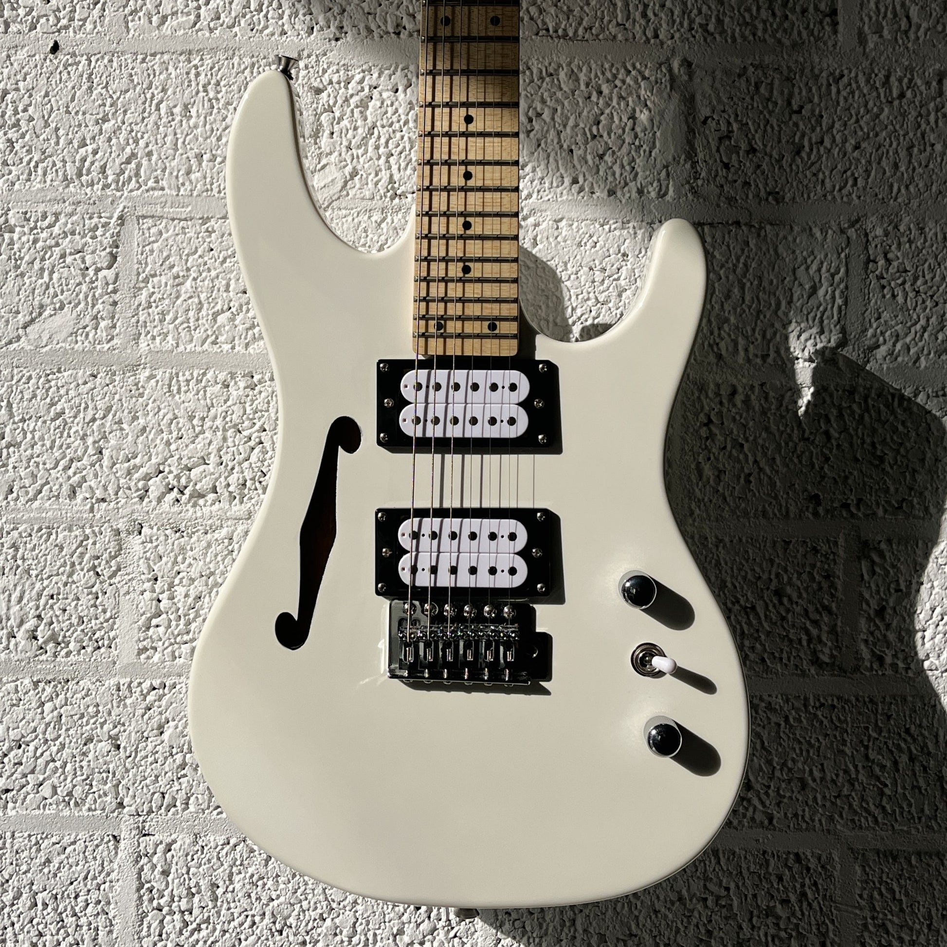 sx sst mini white electric guitar body closeup